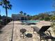 Community pool with surrounding patio and lounge chairs at 3656 Brighton Park Cir, Orlando, FL 32812