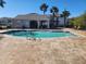 Relaxing community pool area with lounge chairs and patio furniture at 3656 Brighton Park Cir, Orlando, FL 32812