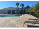 Resort-style pool with plenty of lounge chairs for relaxing at 3656 Brighton Park Cir, Orlando, FL 32812