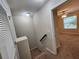 Upper level hallway with access to bedrooms and stairs at 3656 Brighton Park Cir, Orlando, FL 32812