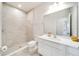 Bathroom with a shower/tub combo, white vanity, and tile flooring at 3975 Great Smokey Way, Apopka, FL 32712