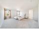 Main bedroom with plush bed and view of the backyard at 3975 Great Smokey Way, Apopka, FL 32712