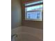 Relaxing bathtub and window with view at 419 Venetian Palms Blvd, New Smyrna Beach, FL 32168