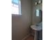 Convenient powder room with pedestal sink at 419 Venetian Palms Blvd, New Smyrna Beach, FL 32168