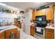 Kitchen offers ample counter space and wood cabinets at 4239 Shades Crest Ln, Sanford, FL 32773