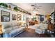 Relaxing living room, featuring comfortable sofas and a view into the kitchen at 4239 Shades Crest Ln, Sanford, FL 32773