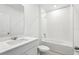 Bathroom with shower-tub combination, white cabinets, and sink at 4508 Windy Oak Way, St Cloud, FL 34772