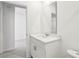 Modern bathroom features a white vanity with quartz countertop and sleek fixtures at 4508 Windy Oak Way, St Cloud, FL 34772