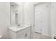 Modern bathroom features a white vanity with quartz countertop and sleek fixtures at 4508 Windy Oak Way, St Cloud, FL 34772