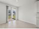 Bright dining area with sliding glass doors leading to the backyard and light tile flooring at 4508 Windy Oak Way, St Cloud, FL 34772