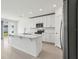 Modern kitchen with stainless steel appliances, white cabinetry, and a kitchen island at 4508 Windy Oak Way, St Cloud, FL 34772