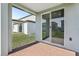 Covered patio with brick flooring and sliding glass doors at 4508 Windy Oak Way, St Cloud, FL 34772