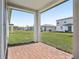 Covered patio with brick flooring and a view of the lawn at 4508 Windy Oak Way, St Cloud, FL 34772