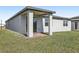 Patio featuring brick floors, concrete pillars and a view of the lawn at 4508 Windy Oak Way, St Cloud, FL 34772