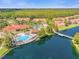 Community pool and clubhouse near a lake at 4765 Ormond Beach Way, Kissimmee, FL 34746