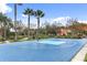 Outdoor basketball court with blue surface and palm trees at 4765 Ormond Beach Way, Kissimmee, FL 34746