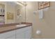 Bathroom with vanity, mirror, and towel rack at 4765 Ormond Beach Way, Kissimmee, FL 34746