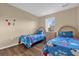 Mickey Mouse themed bedroom with twin beds at 4765 Ormond Beach Way, Kissimmee, FL 34746