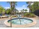 Relaxing hot tub surrounded by lush landscaping at 4765 Ormond Beach Way, Kissimmee, FL 34746