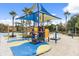 Colorful playground with shade structure and sand area at 4765 Ormond Beach Way, Kissimmee, FL 34746