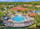 Large pool with sundeck and adjacent clubhouse at 4765 Ormond Beach Way, Kissimmee, FL 34746