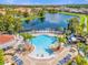 Relaxing pool area with lounge chairs and palm trees at 4765 Ormond Beach Way, Kissimmee, FL 34746