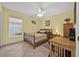 Bedroom with wooden bed frame and desk at 490 Sweetwater Way, Haines City, FL 33844