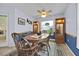 Charming dining room with wooden table and chairs at 490 Sweetwater Way, Haines City, FL 33844