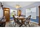 Bright dining area with wooden table and hutch at 490 Sweetwater Way, Haines City, FL 33844