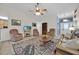 Living room with two armchairs, a sofa, and a coffee table at 490 Sweetwater Way, Haines City, FL 33844