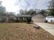 One-story house with attached garage and manicured lawn at 5022 Log Wagon Rd, Ocoee, FL 34761