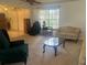 Living room with a couch, coffee table, and entryway view at 5022 Log Wagon Rd, Ocoee, FL 34761