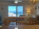 Living area with stunning ocean views and comfy seating at 5300 S Atlantic Ave # 604, New Smyrna Beach, FL 32169