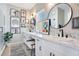 Double vanity bathroom with marble countertops and modern fixtures at 543 Sunbranch Ln, Casselberry, FL 32707