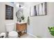 Stylish powder room with wood vanity and modern fixtures at 543 Sunbranch Ln, Casselberry, FL 32707