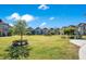 Community green space with several houses at 543 Sunbranch Ln, Casselberry, FL 32707