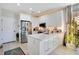 Modern kitchen with white cabinets, stainless steel appliances, and quartz countertops at 543 Sunbranch Ln, Casselberry, FL 32707