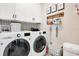 Laundry room with washer, dryer, and ample storage at 543 Sunbranch Ln, Casselberry, FL 32707