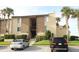 Two-story condo building with parking and landscaping at 596 Orange Dr # 151, Altamonte Springs, FL 32701