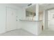 Kitchen with breakfast bar and white cabinets at 596 Orange Dr # 151, Altamonte Springs, FL 32701