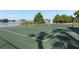 Well-maintained tennis court overlooking a lake at 596 Orange Dr # 151, Altamonte Springs, FL 32701