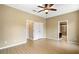 Main bedroom with double doors to the en-suite bathroom and walk-in closet at 745 Andrew St, Eustis, FL 32726