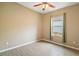 Bright bedroom with ceiling fan and wood-look flooring at 745 Andrew St, Eustis, FL 32726