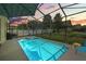 Relaxing screened pool and spa in backyard at 745 Andrew St, Eustis, FL 32726