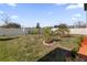 Landscaped backyard with young fruit trees and a large lawn at 9118 Waverly Walk Dr, Orlando, FL 32817