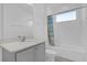 Clean bathroom with a shower/tub combo and gray vanity at 9118 Waverly Walk Dr, Orlando, FL 32817