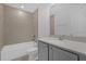 Clean bathroom with tub, toilet, and gray vanity at 9118 Waverly Walk Dr, Orlando, FL 32817