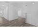 Upstairs hallway with light wood laminate flooring at 9118 Waverly Walk Dr, Orlando, FL 32817