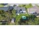 Aerial view of house, yard, pool, and shed at 10140 Bridlewood Ave, Orlando, FL 32825