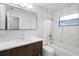 Modern bathroom with marble-tiled shower and updated vanity at 10140 Bridlewood Ave, Orlando, FL 32825